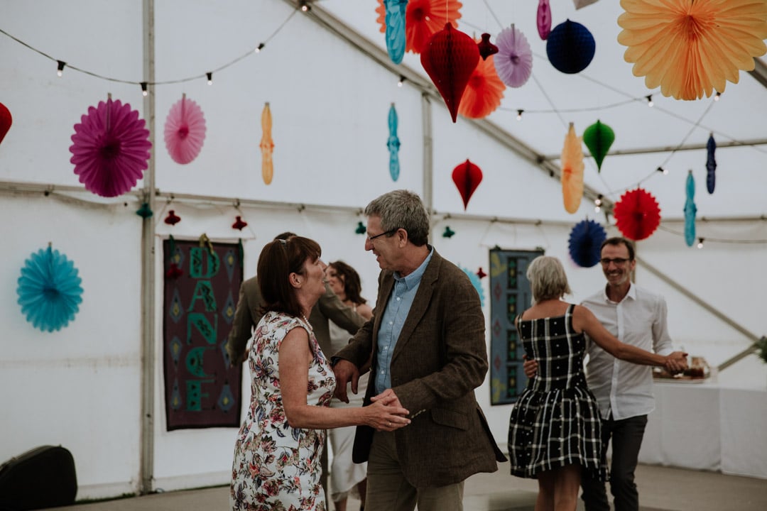 wedding-guests-dancing-marquee-wedding-hanging-paper-decorations