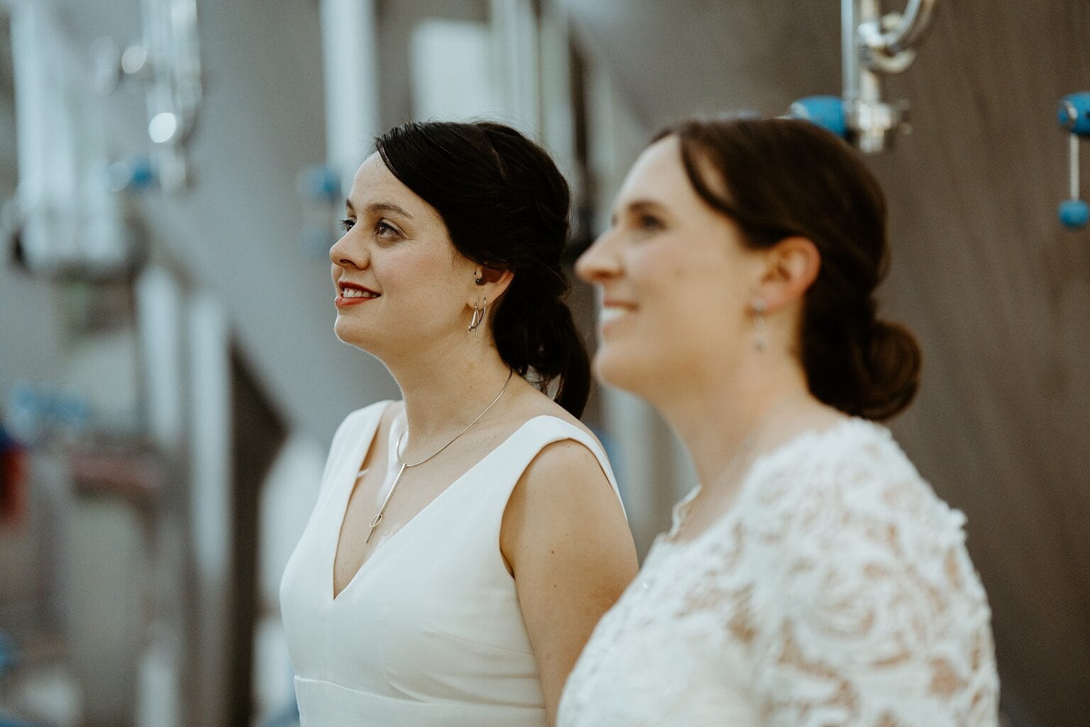 close up of brides smiling as they look into the distance west on the green wedding scotland