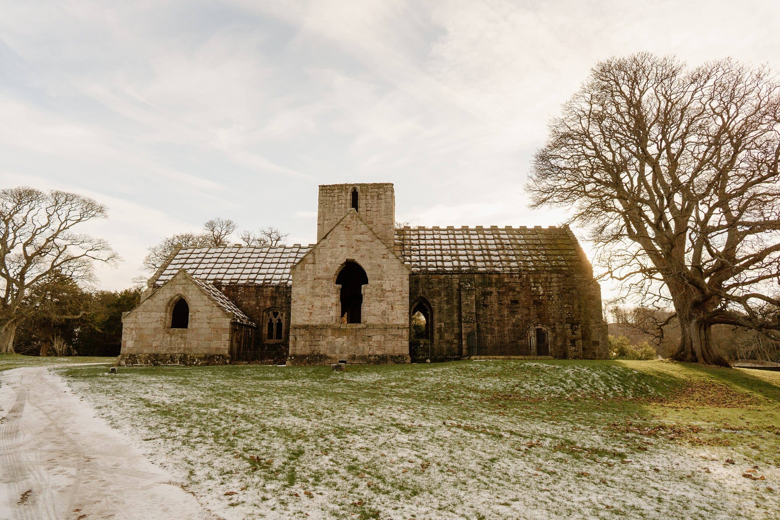 external outside view of dunglass estate wedding photos chapel church scotland on snowy winter day