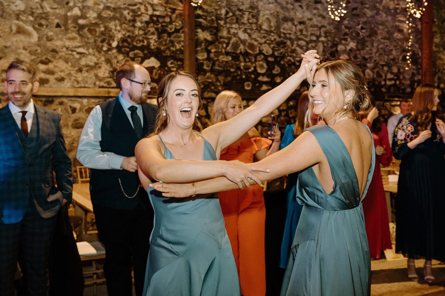 bridesmaids dancing at a wedding reception at a farm wedding venue near glasgow scotland