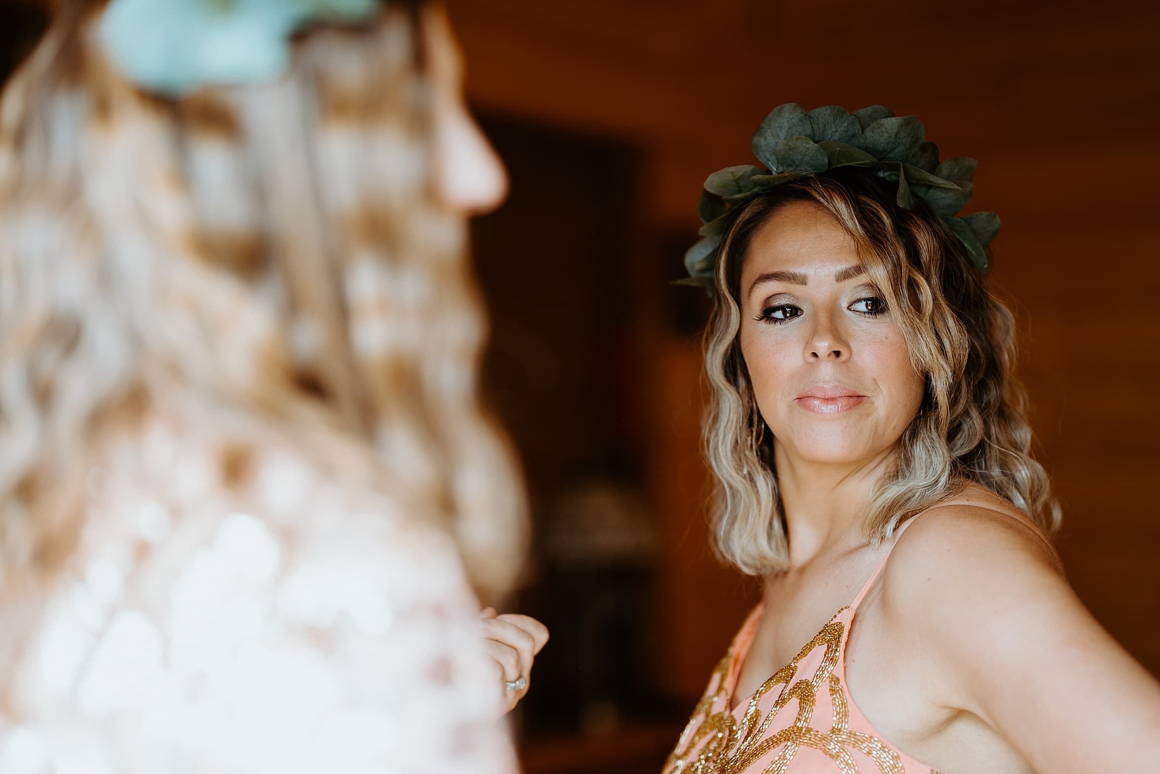 picture of bridesmaid with blonde wavy hair wearing green floral crown cardney steading wedding scotland