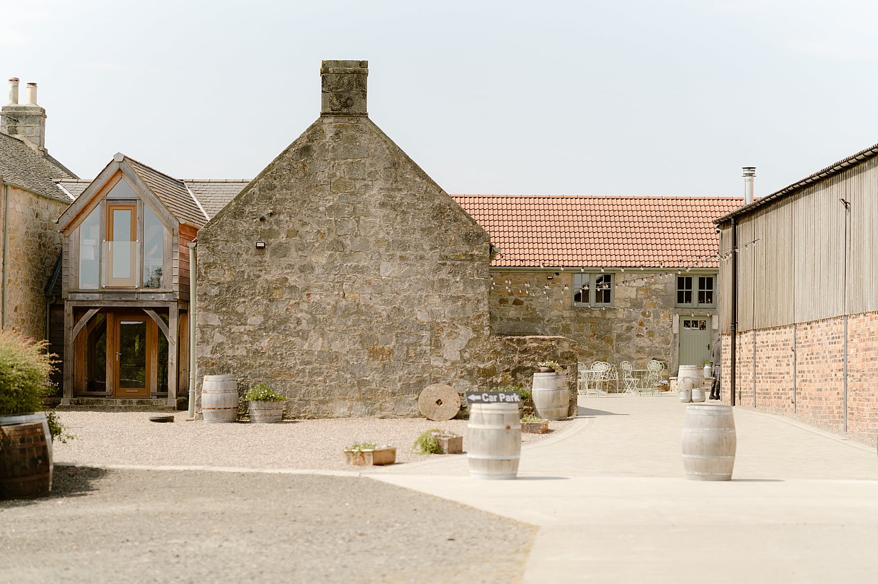 external view of courtyard set up for a the den at culross wedding venue