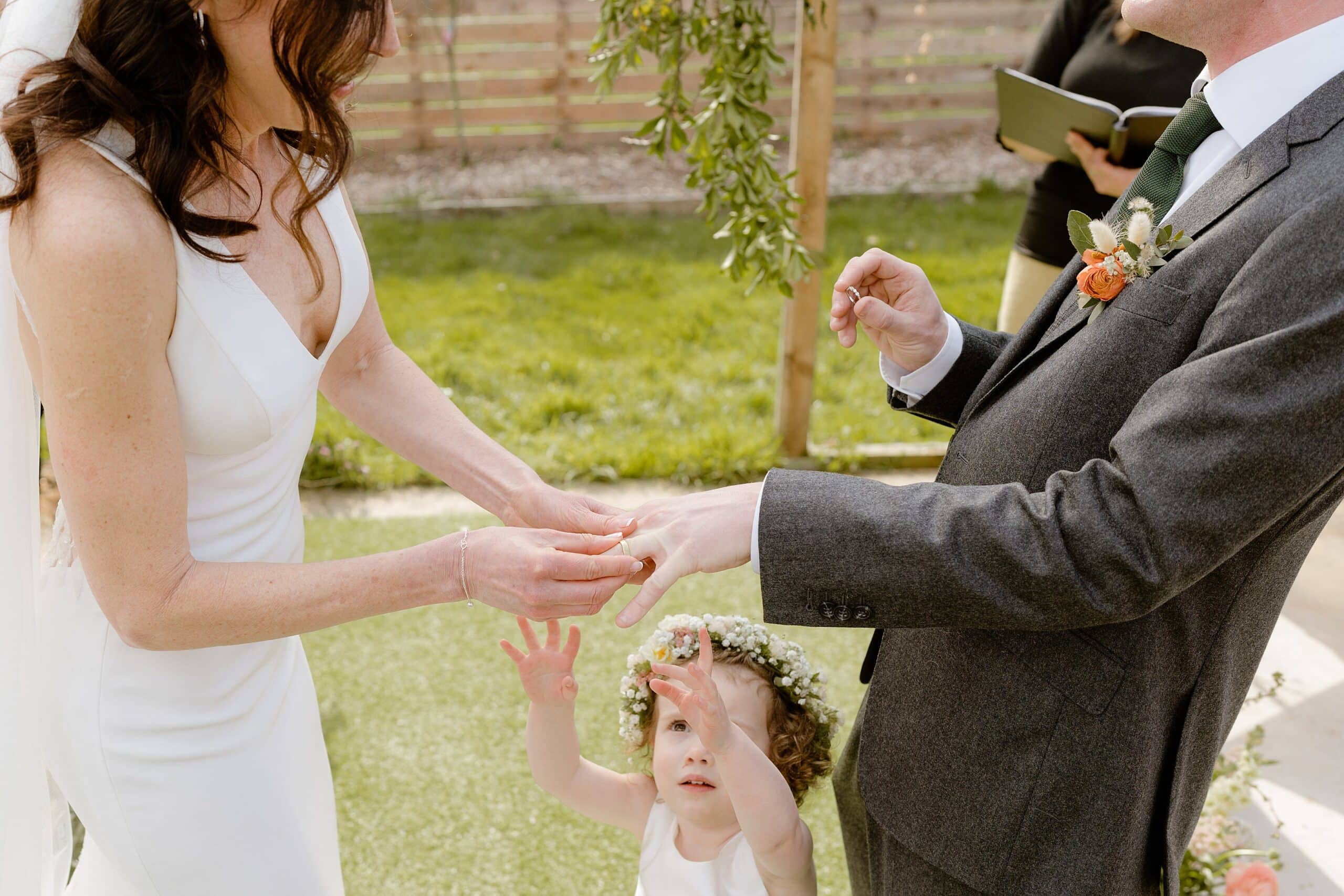 the bride and groom exchange rings during their unusual wedding venues east lothian wedding ceremony near edinburgh scotland
