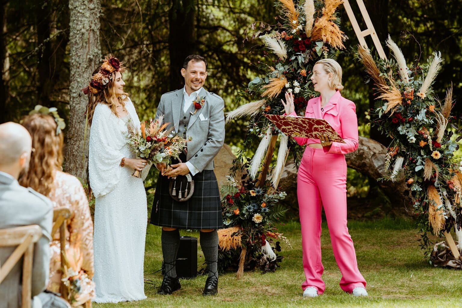bride and groom outdoor ceremony with forest in background wedding trends scottish wedding photography